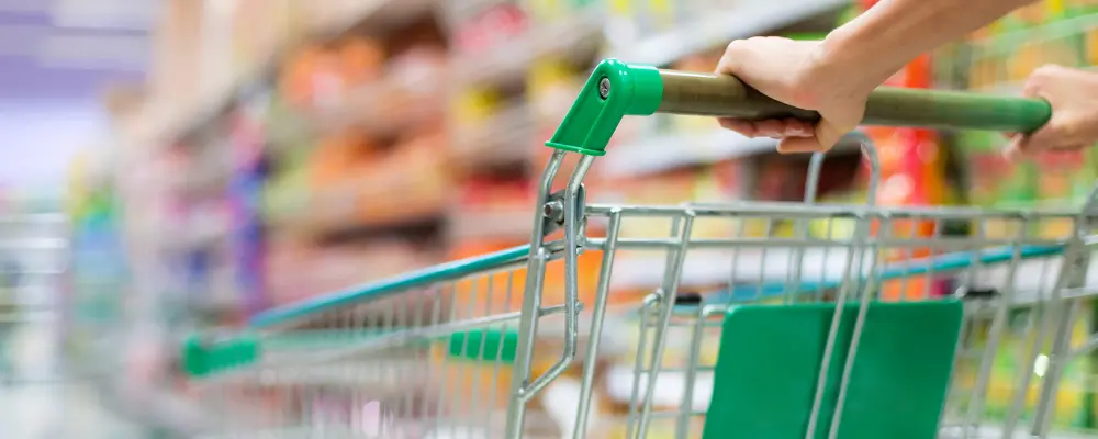 Shopping trolley in a supermarket aisle